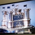 Image of Silver Castle artefact displayed on screen behind desk
