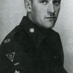 Sgt Bruce Plimer, showing collar and sleeve badges