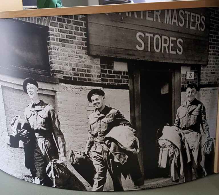 QM's Stores graphic on front of desk